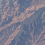 ISS043E182476 (05/08/2015) ---The US rugged southern Utah area is highlighted in this image captured by NASA astronaut Scott Kelly from the International Space Station May, 8th, 2015.  The area shown is the Forbidden Canyon, Rainbow Plateau and San Juan River.