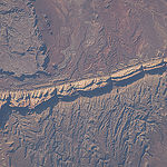 ISS043E182498 (05/08/2015) --- Expedition 43 Flight Engineer Scott Kelly tweeted this view of an American southwest section of the San Rafael Reef, Utah. Kelly added this comment to the tweet: "The rising sun casts shadows upon the US #SouthWest this morning creating a striking image. #YearInSpace".