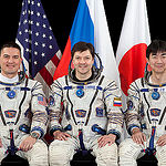 JSC2015E053687 (04/30/2015) --- Expedition 44 crew members NASA astronaut Kjell Lindgren (left), Russian cosmonaut Oleg Kononenko (center) and Japan Aerospace Exploration Agency (JAXA) astronaut Kimiya Yui.