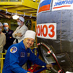 In the Integration Facility at the Baikonur Cosmodrome in Kazakhstan, Expedition 44 crewmember Oleg Kononenko of the Russian Federal Space Agency (Roscosmos) poses for pictures July 11 prior to entering his Soyuz TMA-17M spacecraft during a fit check dress rehearsal session. Kononenko, Kjell Lindgren of NASA and Kimiya Yui of the Japan Aerospace Exploration Agency will launch July 23, Kazakh time from Baikonur in their Soyuz TMA-17M spacecraft for a five-month mission on the International Space Station. Credit: Gagarin Cosmonaut Training Center