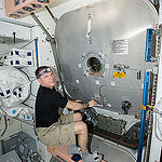 ISS043E256577 (05/26/2015) --- Expedition 43 commander and NASA astronaut Terry Virts is seen here closing the hatch to the Leonardo Permanent Multipurpose Module (PMM.) The PMM was moved on May 27, 2015 from the Unity node to the Tranquility node. This freed up a docking port on the Earth-facing side of Unity for visiting cargo vehicles and was the latest activity in the ongoing upgrades to the station to prepare for future U.S. commercial crew vehicles.